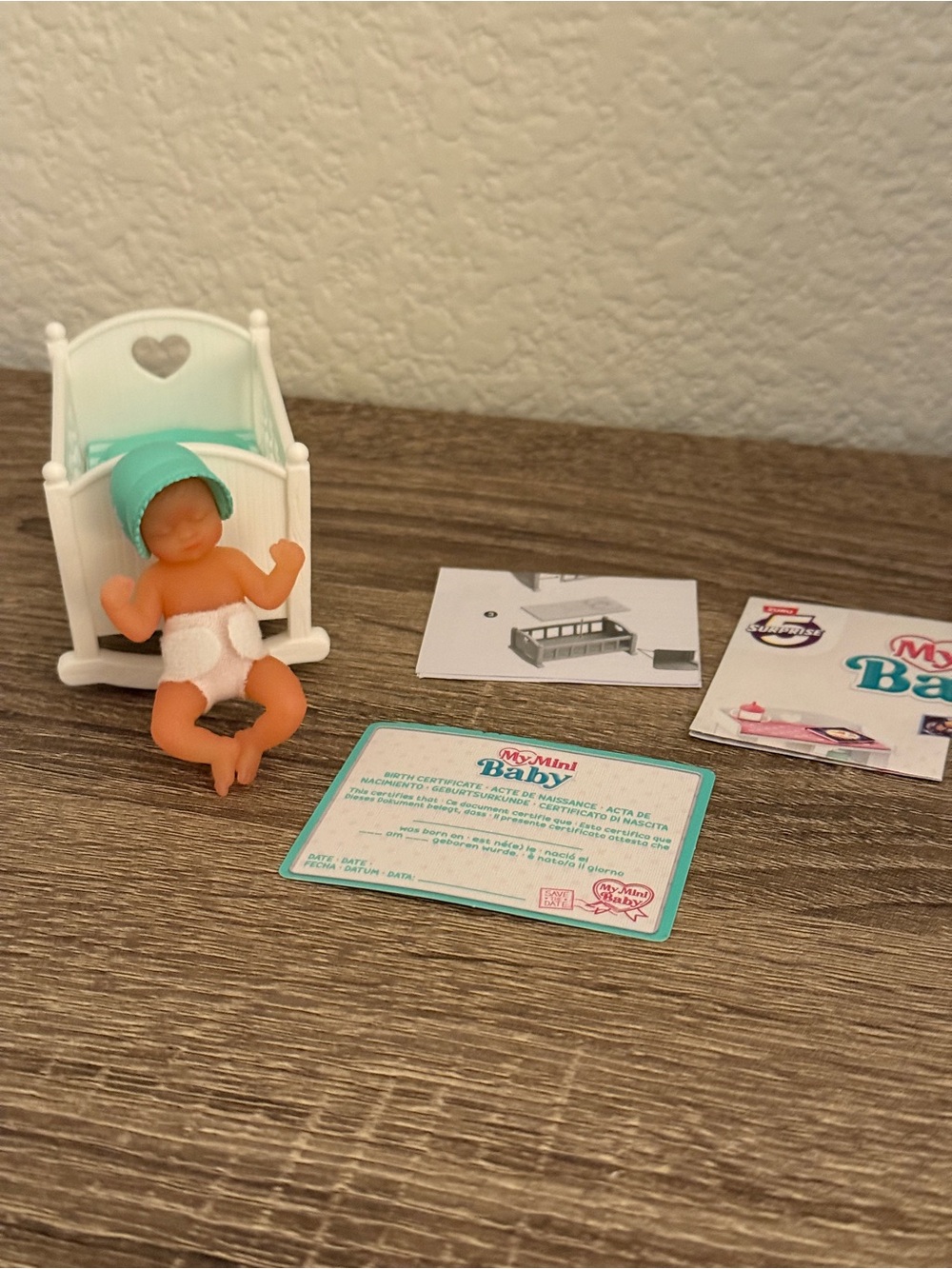 The Zuru My Mini Baby Series 1 Rare Teal Green Rocker/Crib Set with Baby